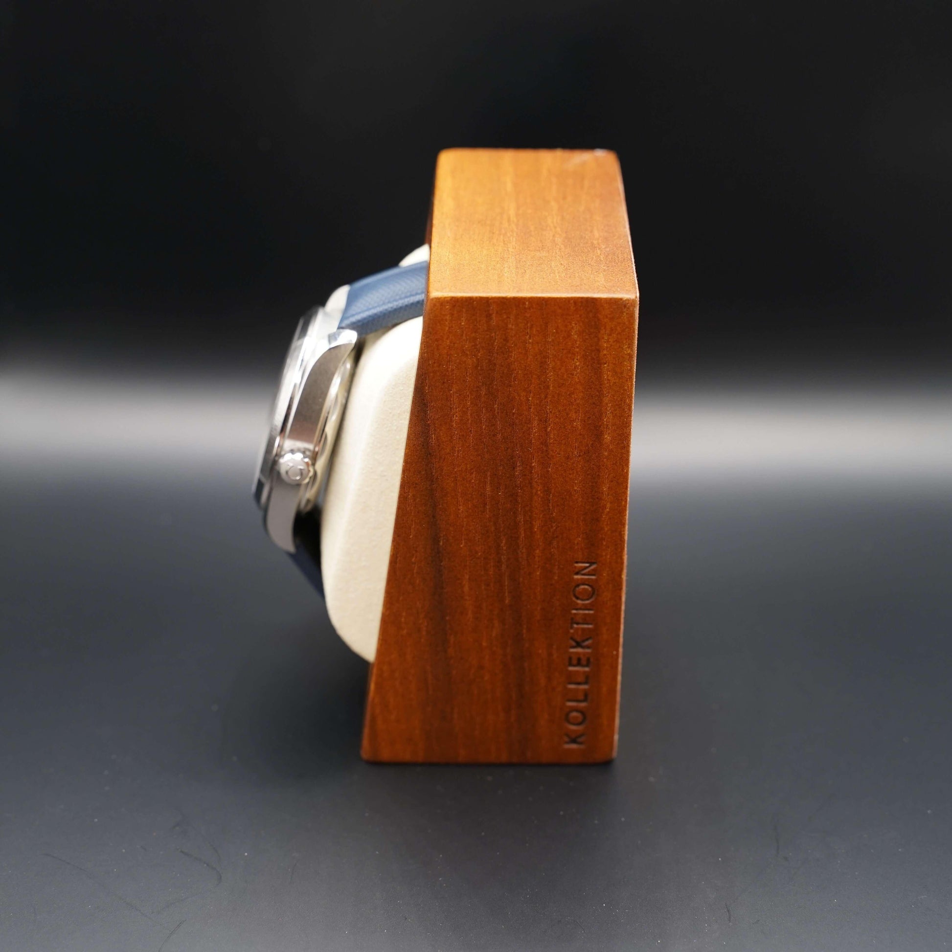 A beige wooden watch case with a microsuede interior is a great way to keep your watches safe and secure. This high-quality case is available in both beige and grey.