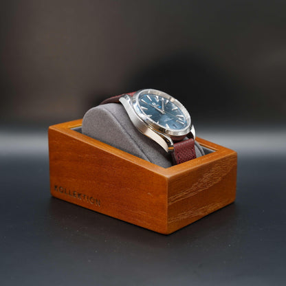 Grey wooden watch case with microsuede interior. A stylish and functional way to store your watches. Made of high-quality wood and microsuede. Available in beige and grey.